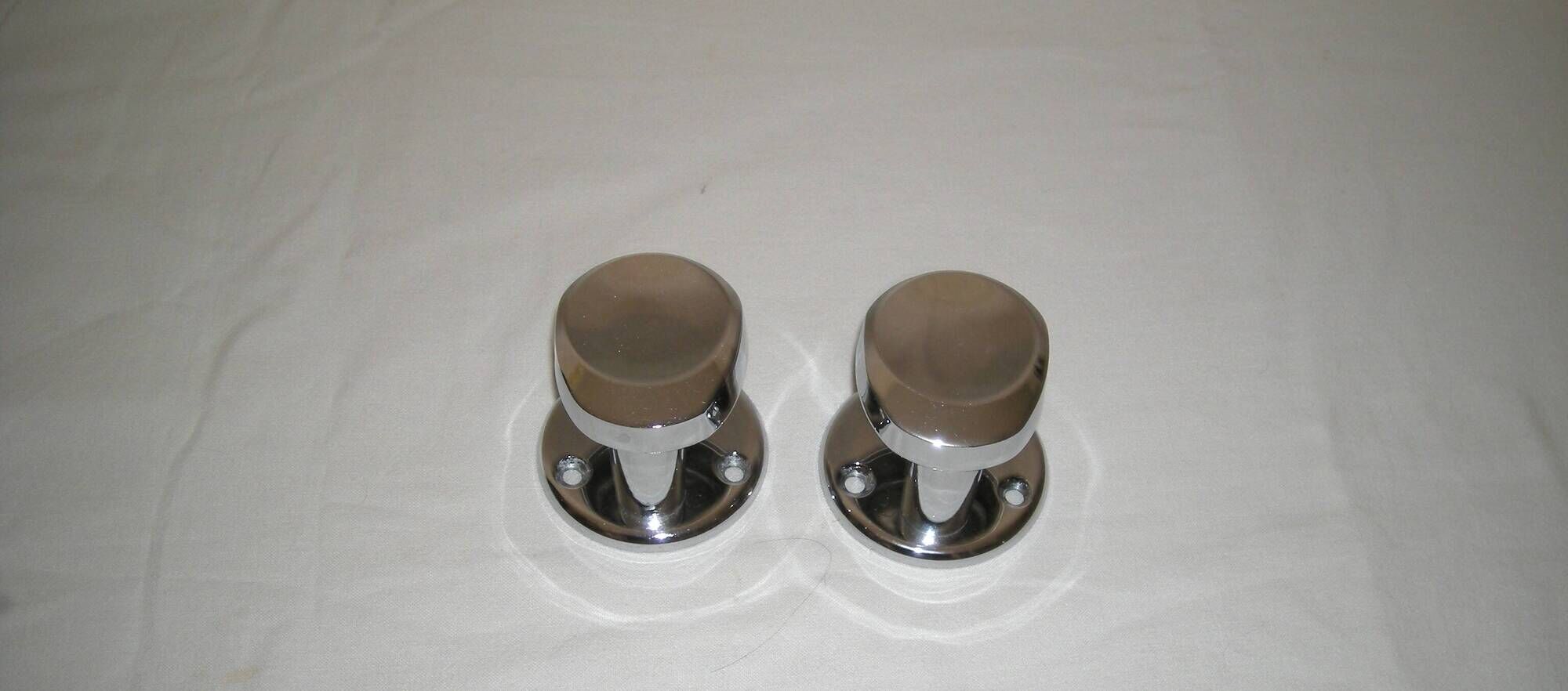 Pair of stainless steel coat racks from the 1970s.