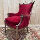 Art Nouveau gondola armchair – Carved wood & red theatre velvet – France