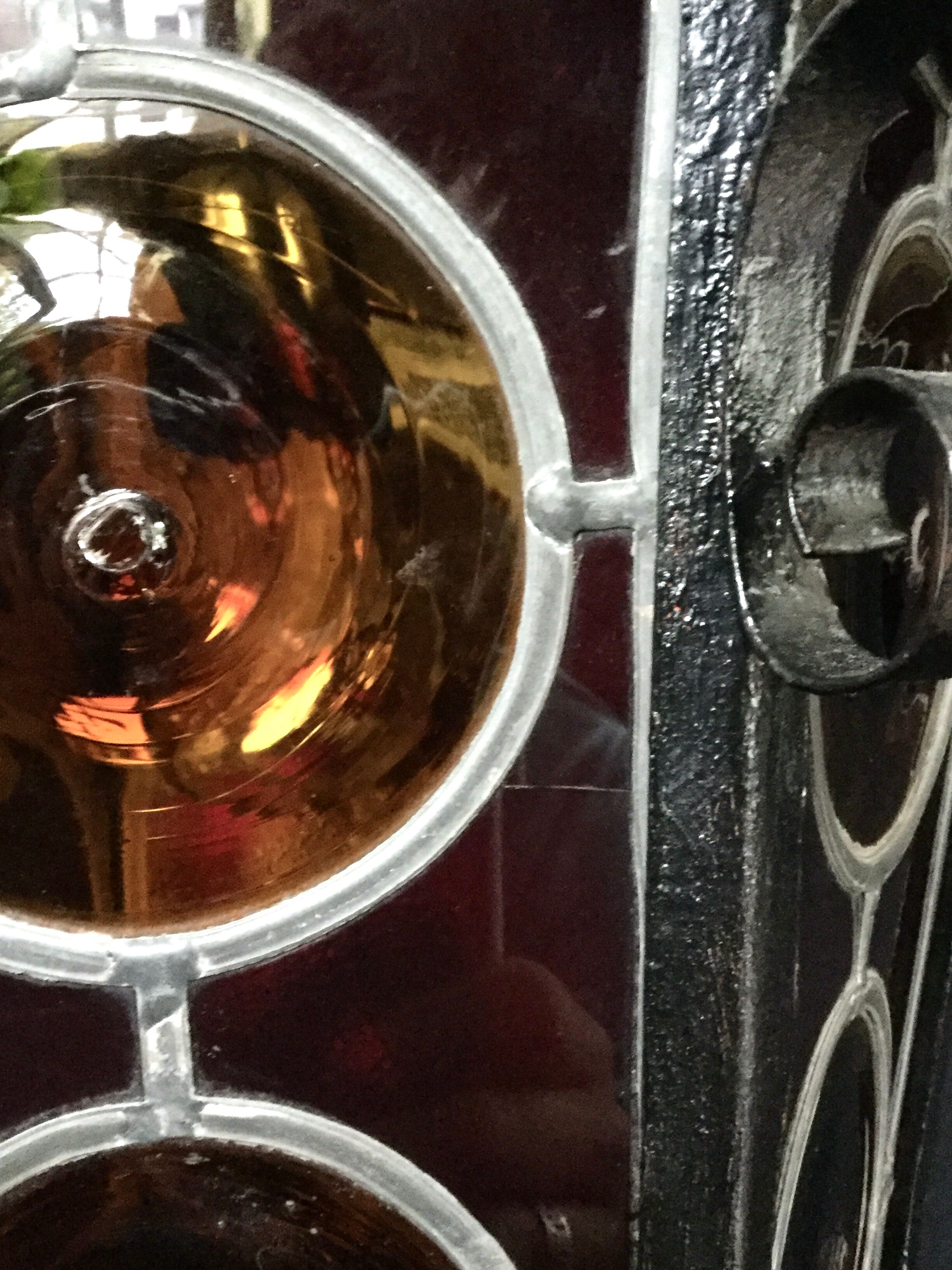 Wrought iron lantern and stained glass windows