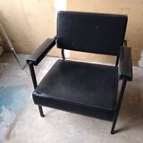 Armchair year 70 . Black skaï and black treated steel square tube. Good condition of the skaï