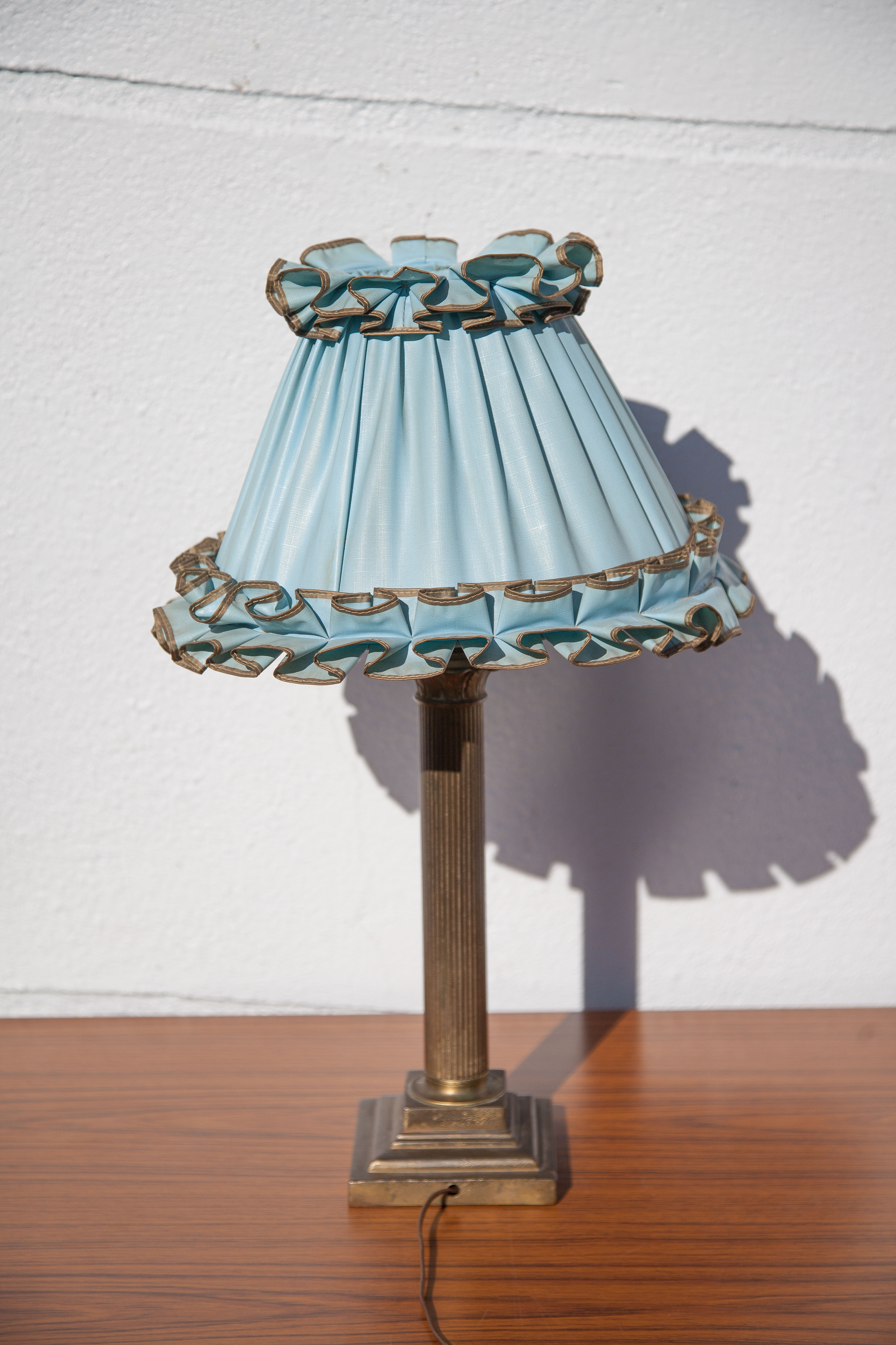 Brass lamp with vintage blue laminated lampshade