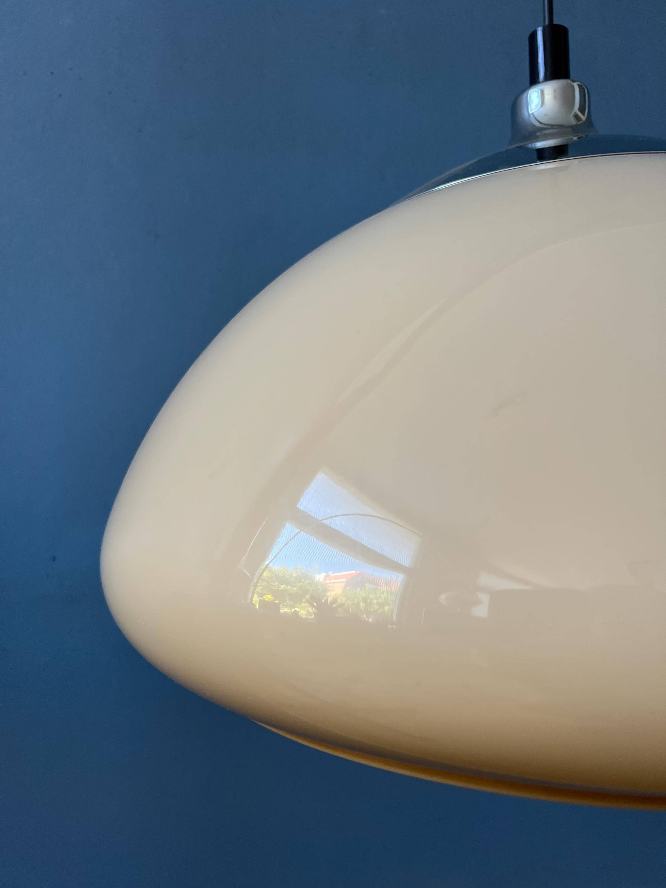 Beige acrylic glass mushroom pendant with a chrome top cap.