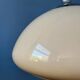 Beige acrylic glass mushroom pendant with a chrome top cap.