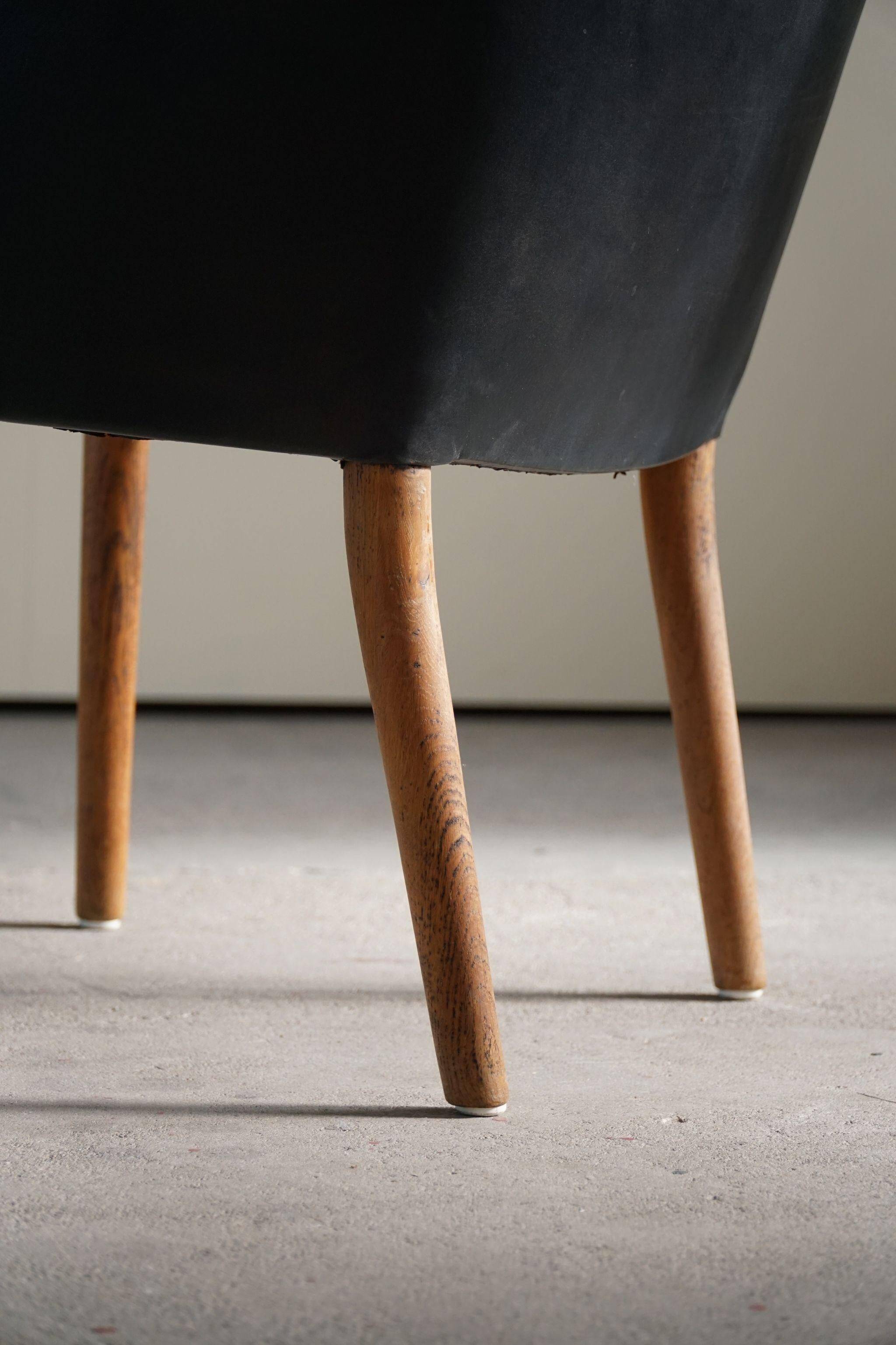 Fauteuil Danemark Moderne par Nanna Ditzel en chêne et cuir patiné, années 1950