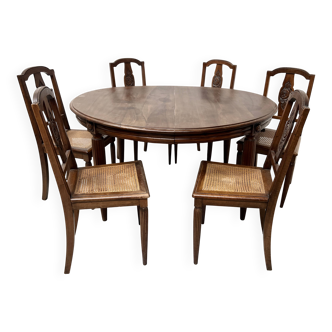 Art Deco table and six chairs in solid walnut, 20th century.