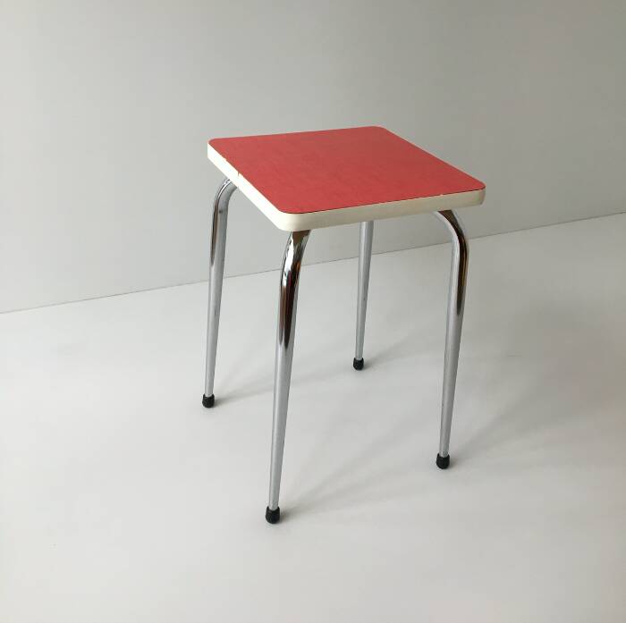 Stool in pinkish red formica