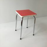 Stool in pinkish red formica