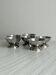 Set of 6 polished stainless steel footed bowls