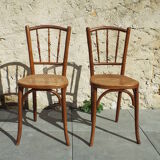 2 bistro chairs seated tanned