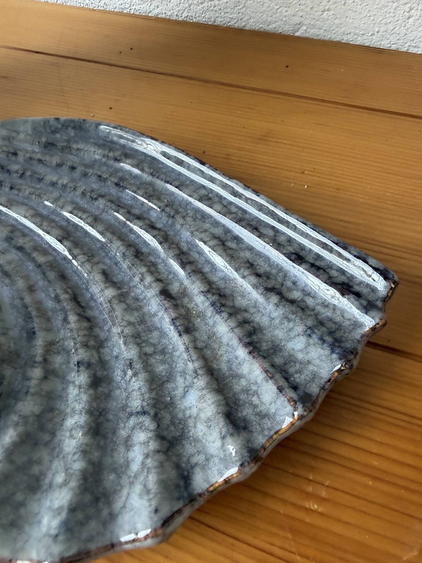 Shell-shaped ceramic catchall.