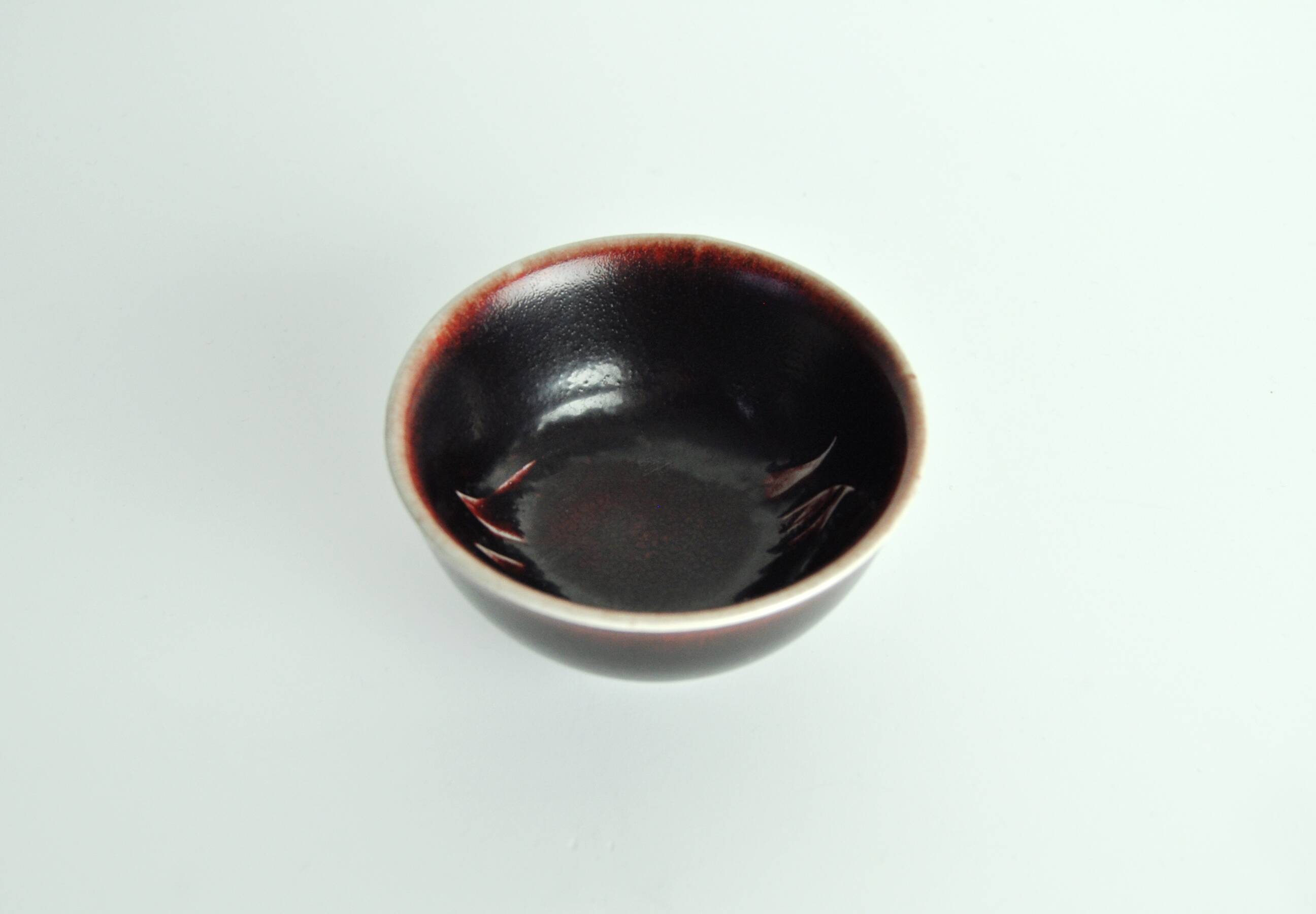 Bowl with oxblood glaze by Gerd Bøgelund for Royal Copenhagen, Denmark