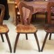 3 brutalist wooden tripod chairs