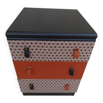 Three-drawer wooden and faux leather chest of drawers on wheels, completely refurbished.
