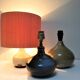 Three vintage ceramic lamps in blue, white and suede