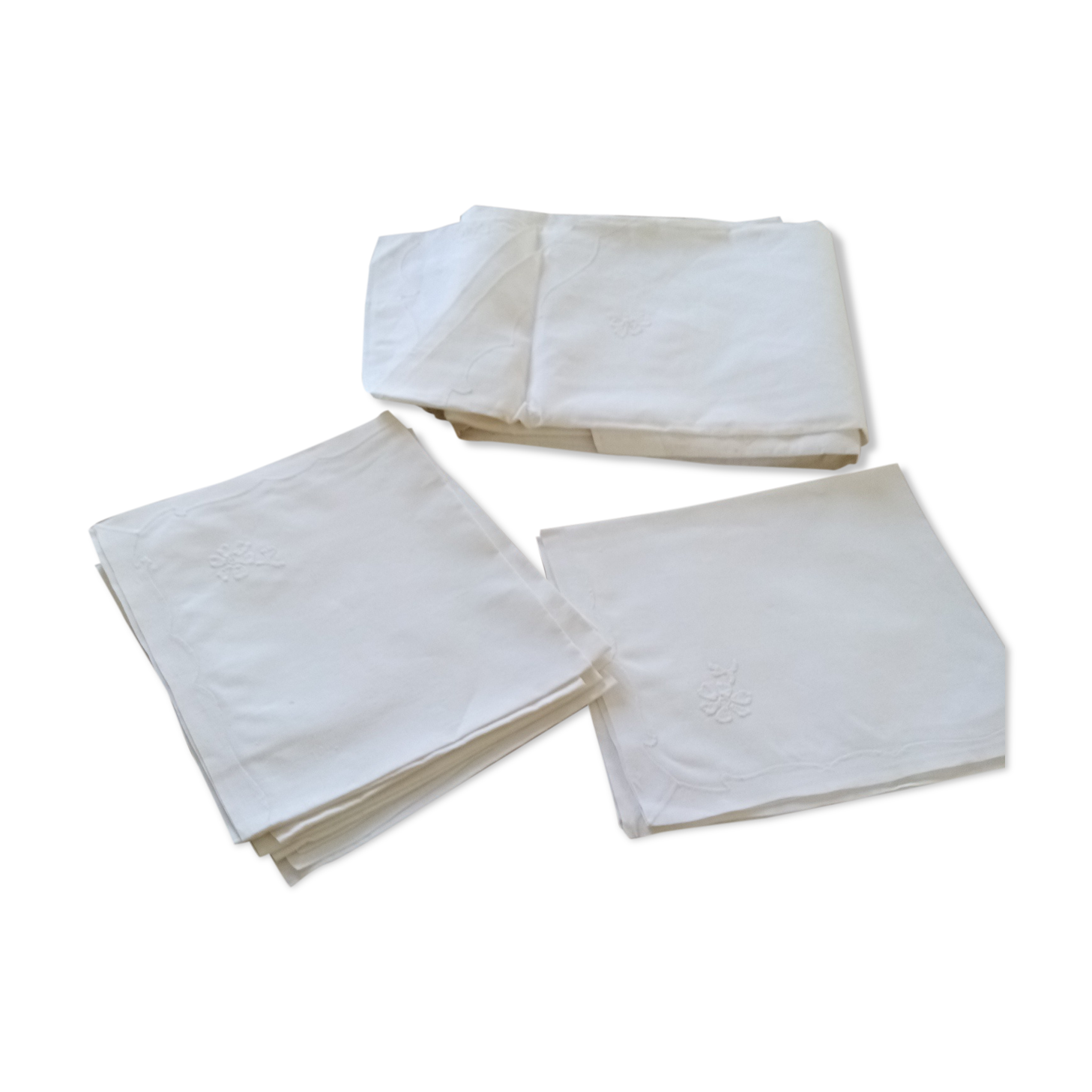 Antique white tablecloth embroidered with flowers and matching napkins