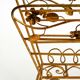 Extraordinary mid-century newspaper and magazine rack with a gilded metal