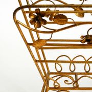 Extraordinary mid-century newspaper and magazine rack with a gilded metal
