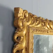 Eclectic antique mirror in carved and gilded wood, Italy, 20th century