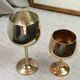 Green stemmed, brass chalices