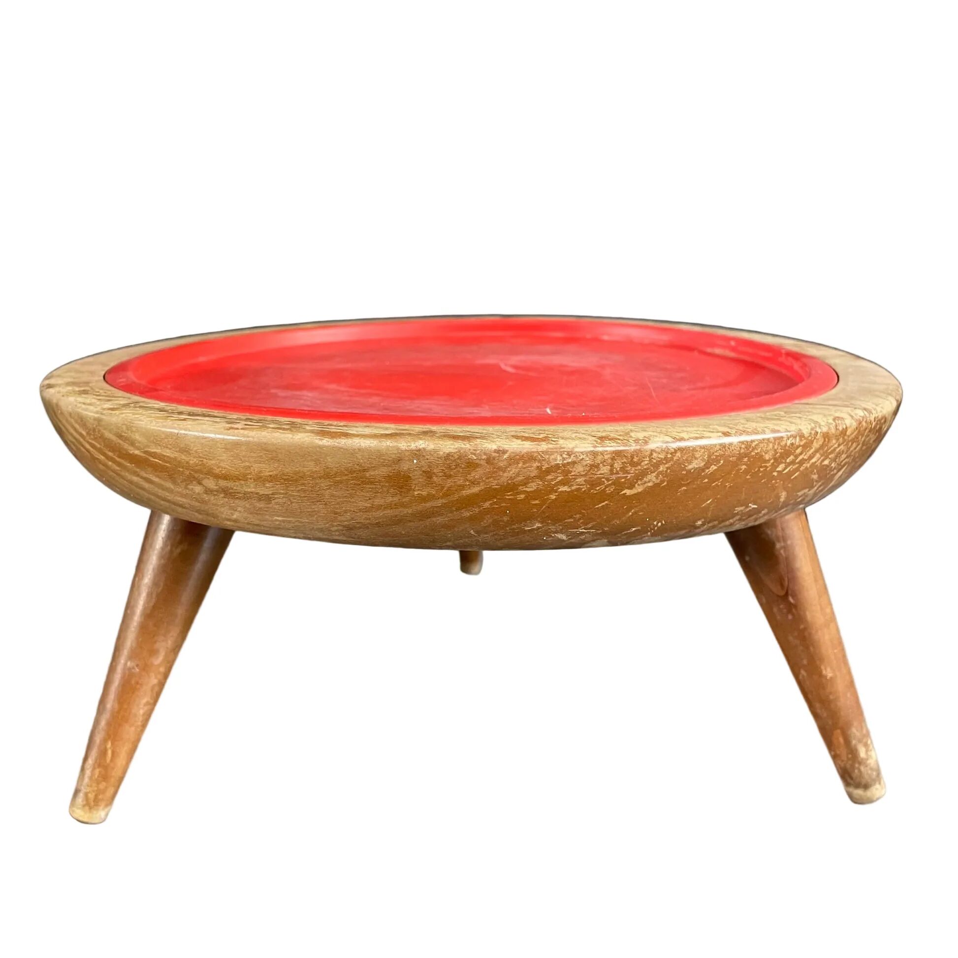 Wooden and red plastic compasses plant stand.