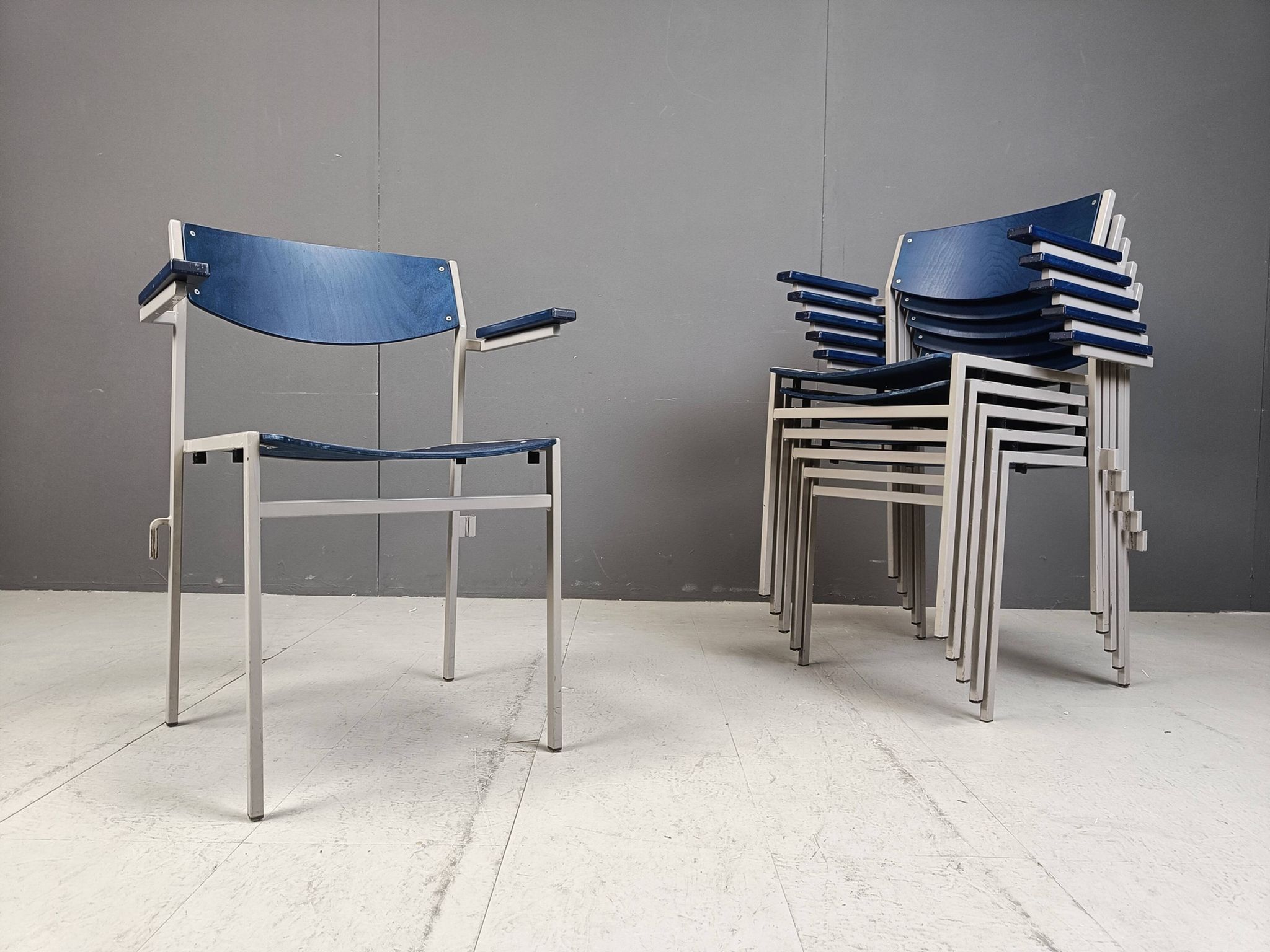 Minimalist metal and plywood stackable armchairs by Gijs Van Der Sluis