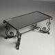 Wrought iron coffee table with mirror glass