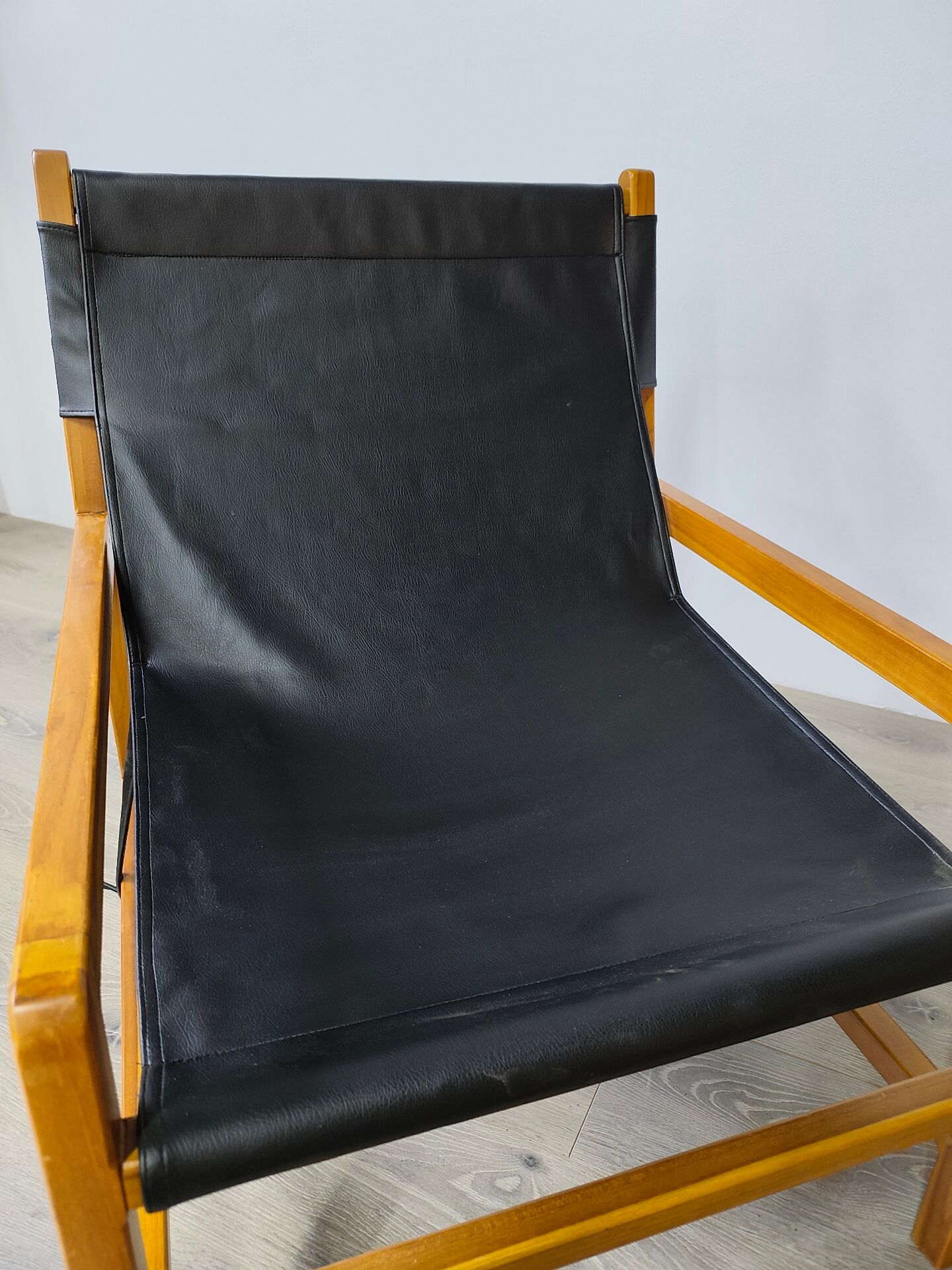Leather and teak armchair