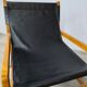 Leather and teak armchair
