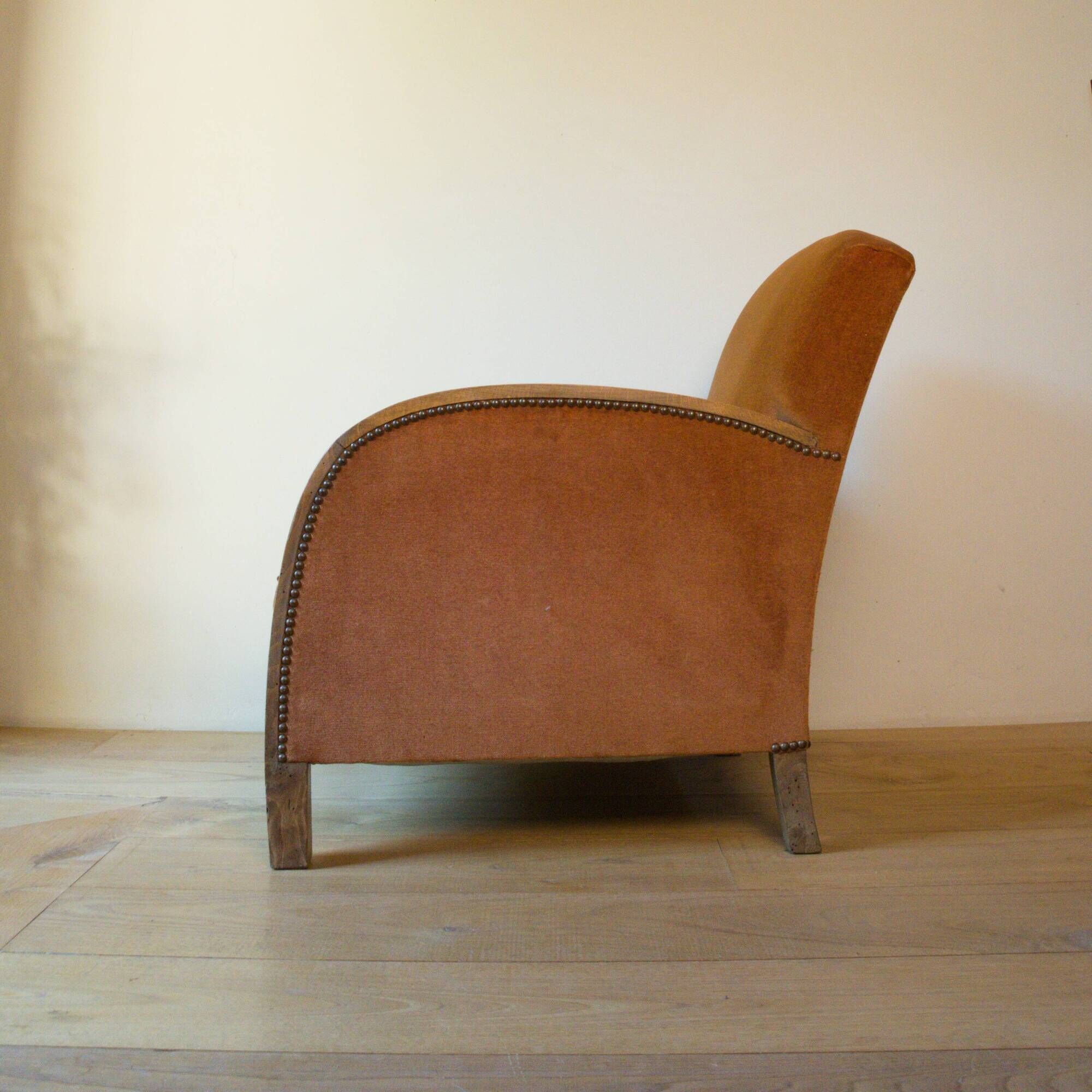 Art Deco club armchair in wood and rust brown velvet, circa 1930.