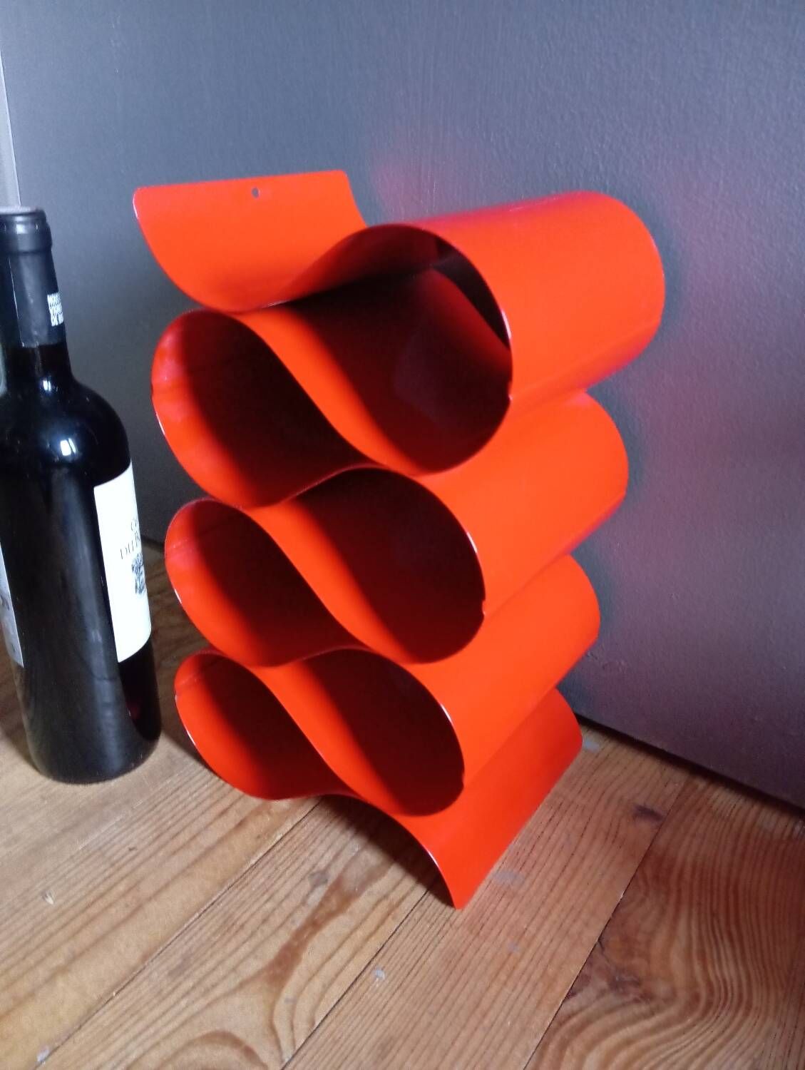 Red painted metal bottle holder, vintage 1980
