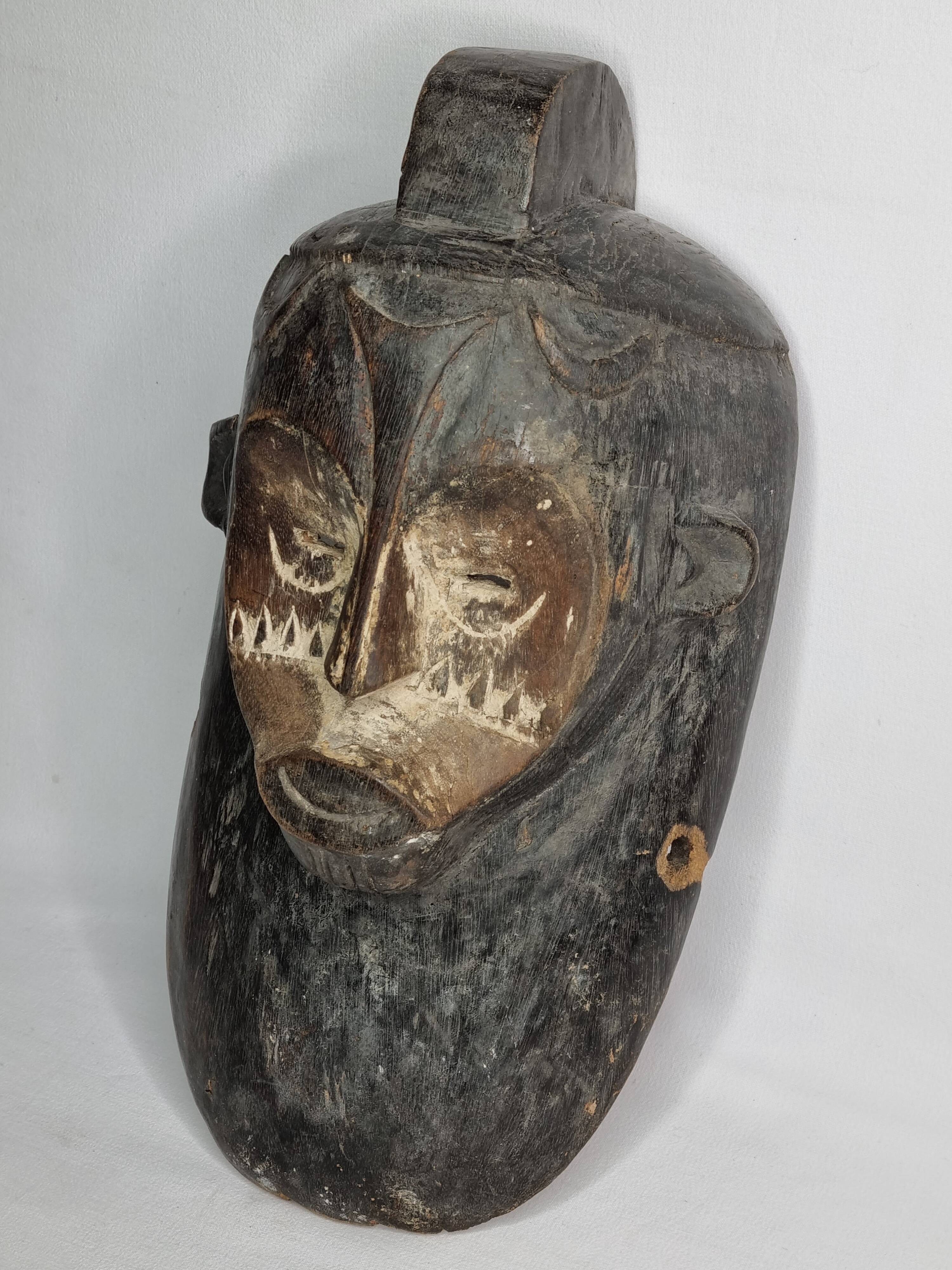 Ancient Fang Ngil tribal mask, traditional African art, Gabon, 20th century, 40 cm