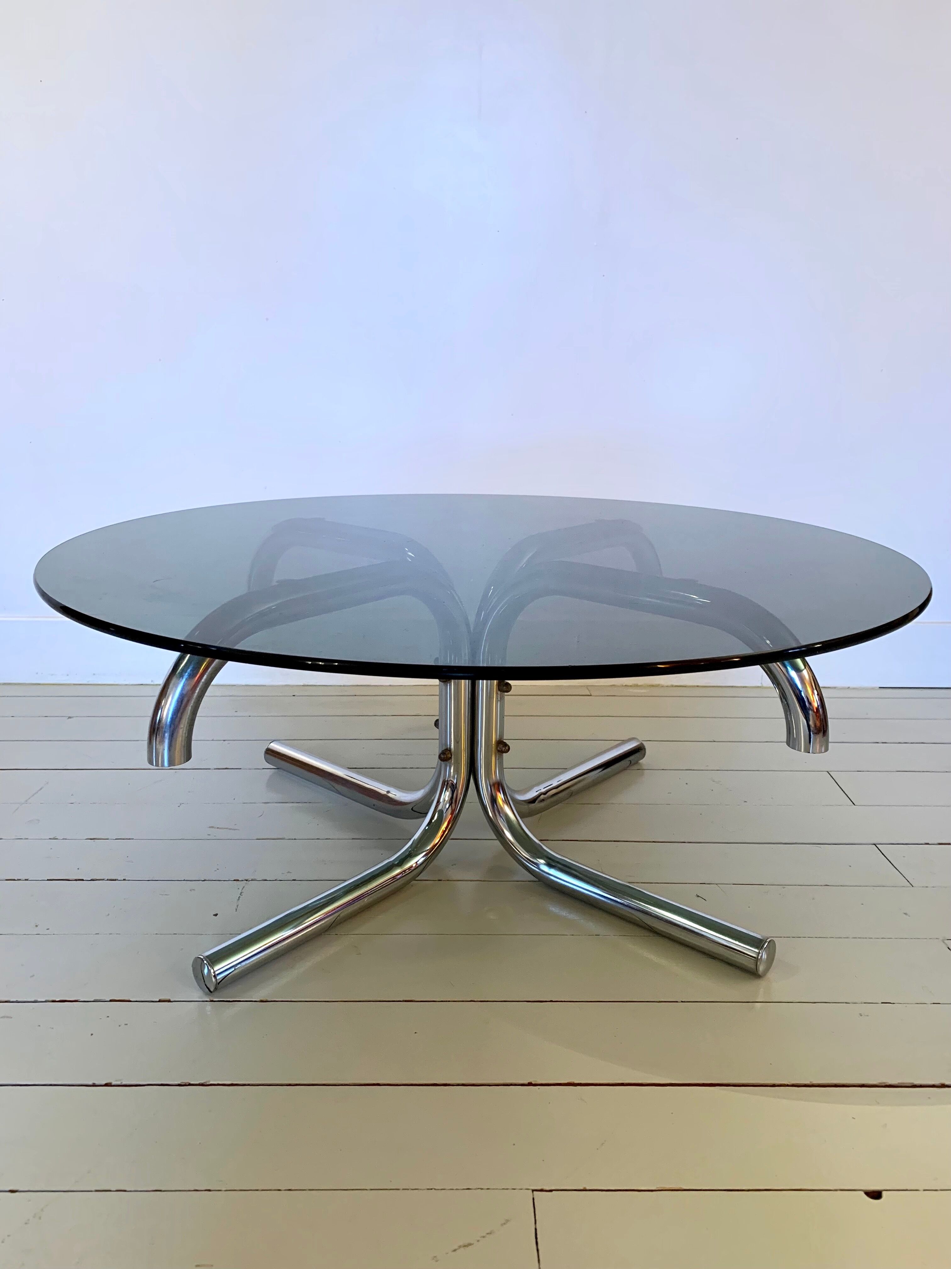 Glass and tubular metal coffee table