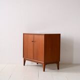 Storage cabinet with hinged doors