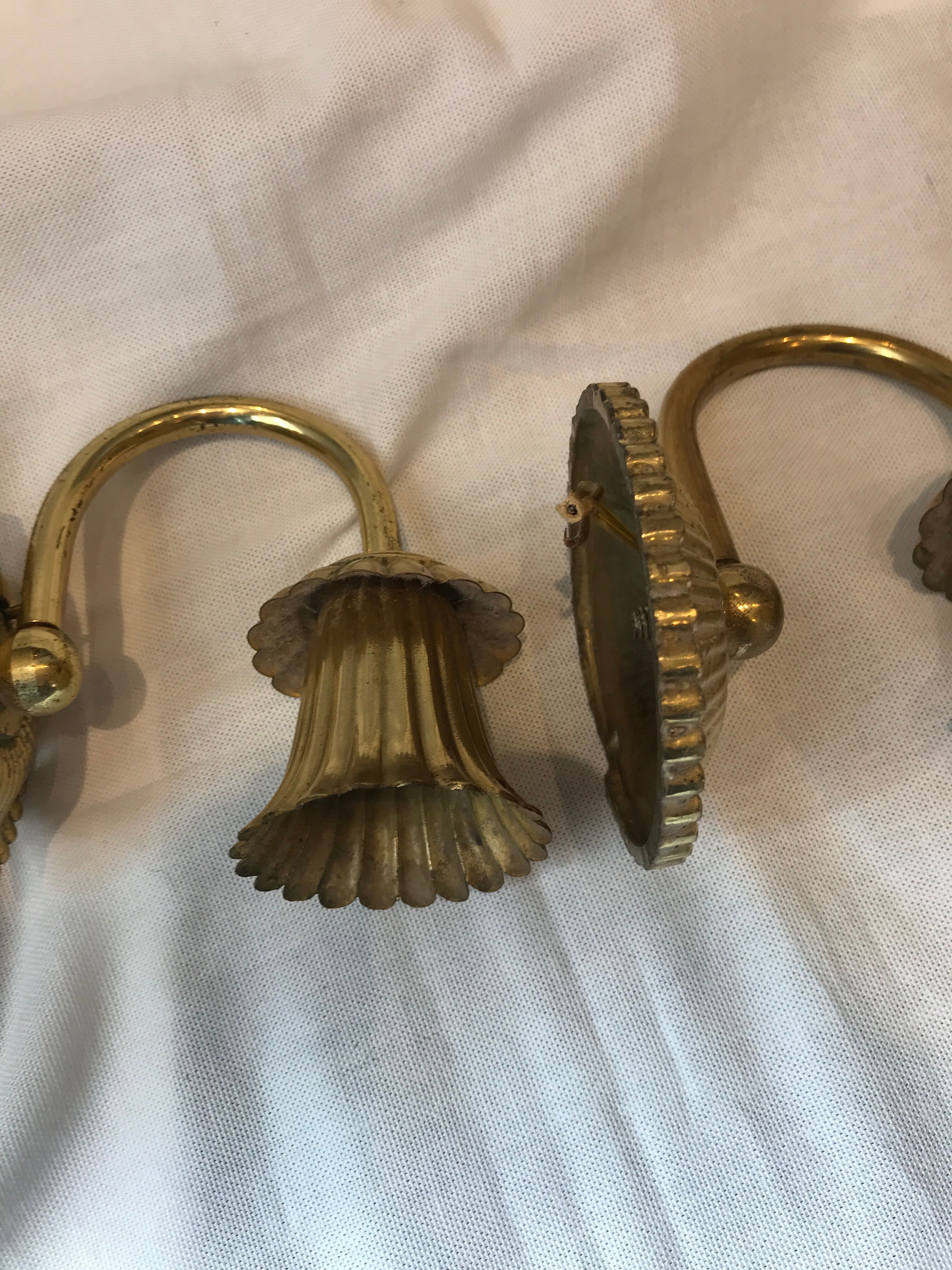 Pair of golden wall light