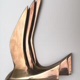 Birds stylized in brass