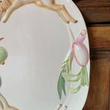 Very large serving dish with hares and vegetables.