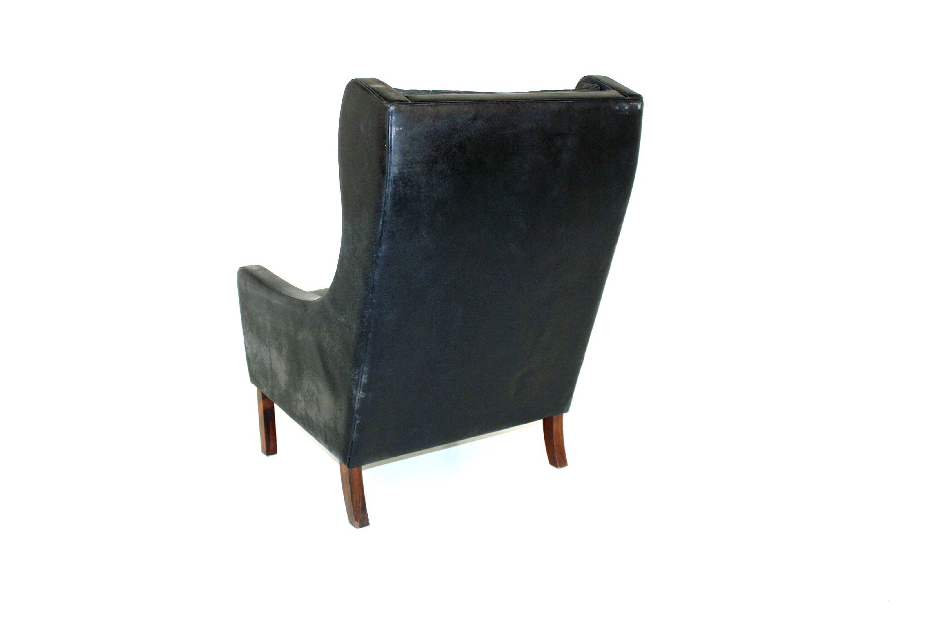 Fauteuil en cuir et palissandre Danemark 1960