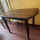 Vintage antique oak table with ornate legs.