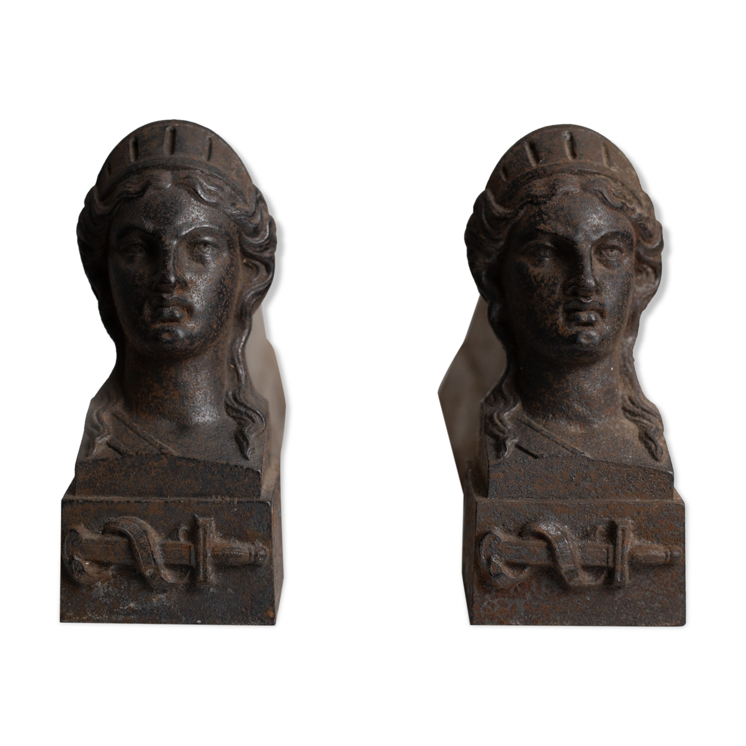 Pair of ancient cast iron chenets adorned with bust of Marianne