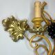 Large pair of wall sconces with vine decorations.