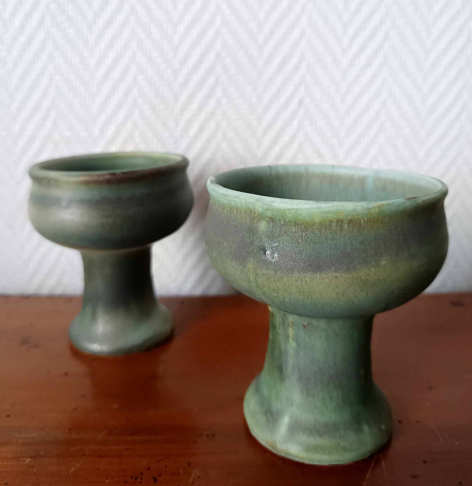 Pair of Belgian ceramic candlesticks on feet