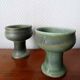 Pair of Belgian ceramic candlesticks on feet