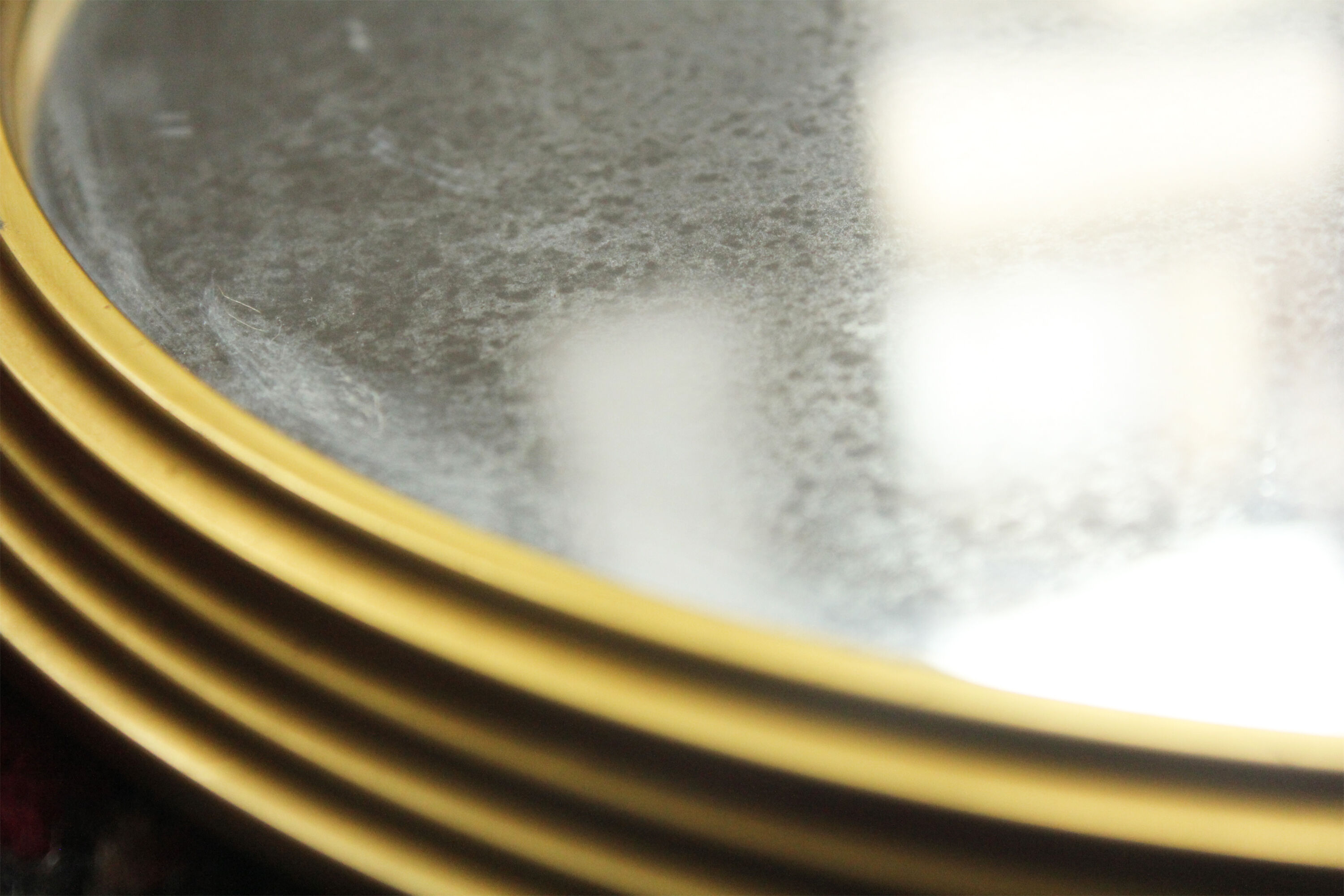 Miroir vintage rond  bordure acier doré