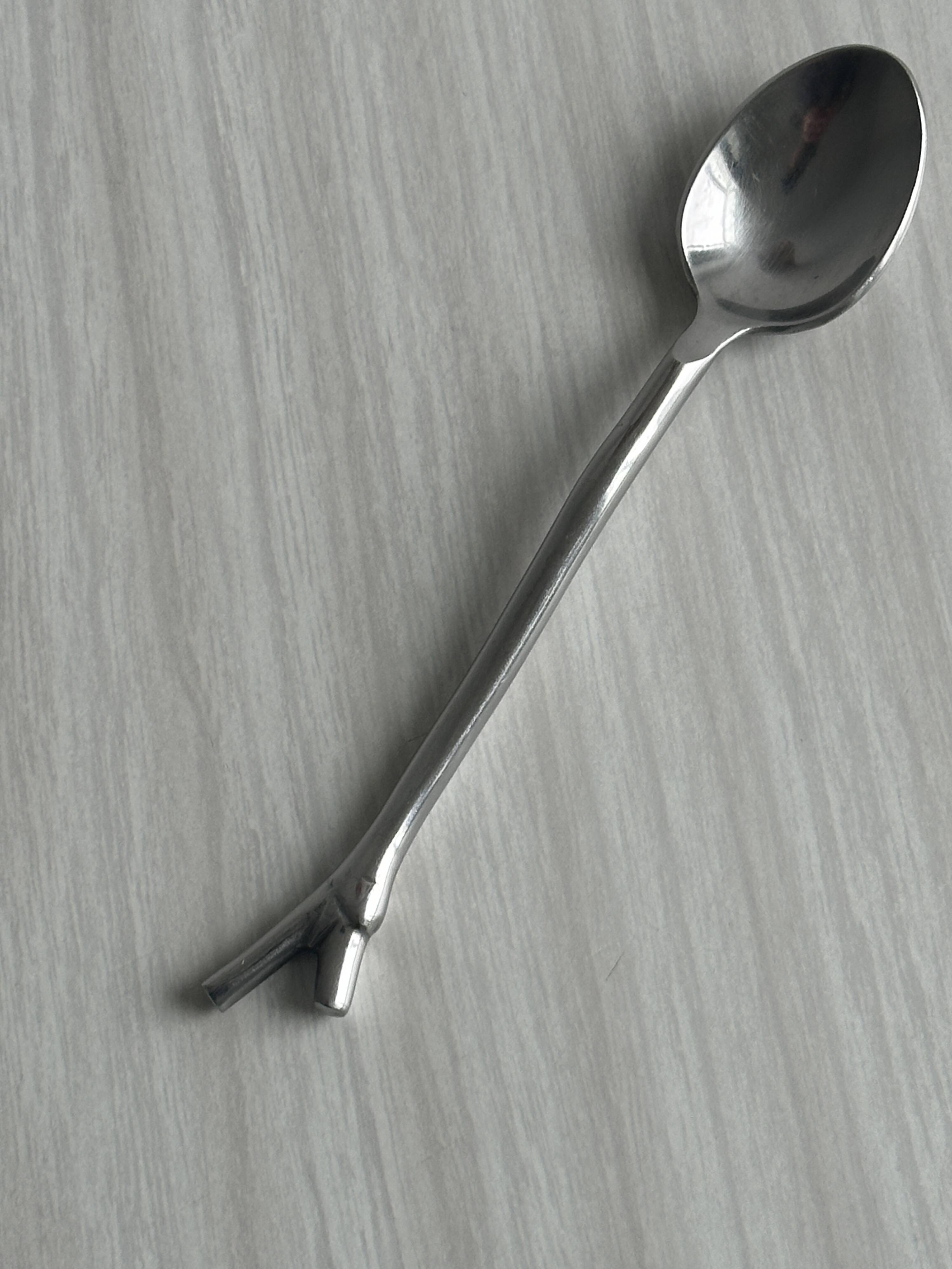 5 small silver metal spoons
