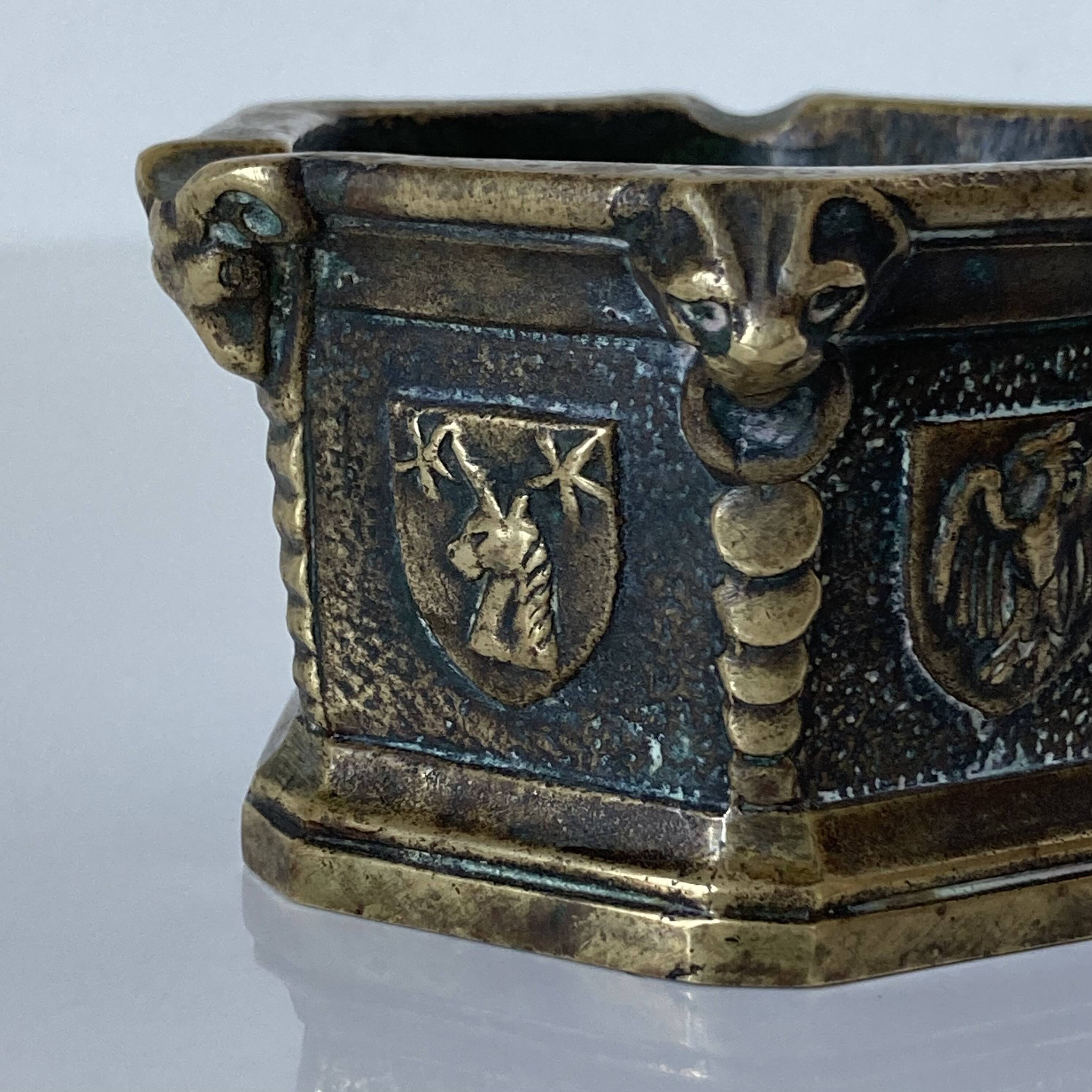 Gothic style bronze ashtray in the shape of a well with heraldic motifs by Max Le Verrier