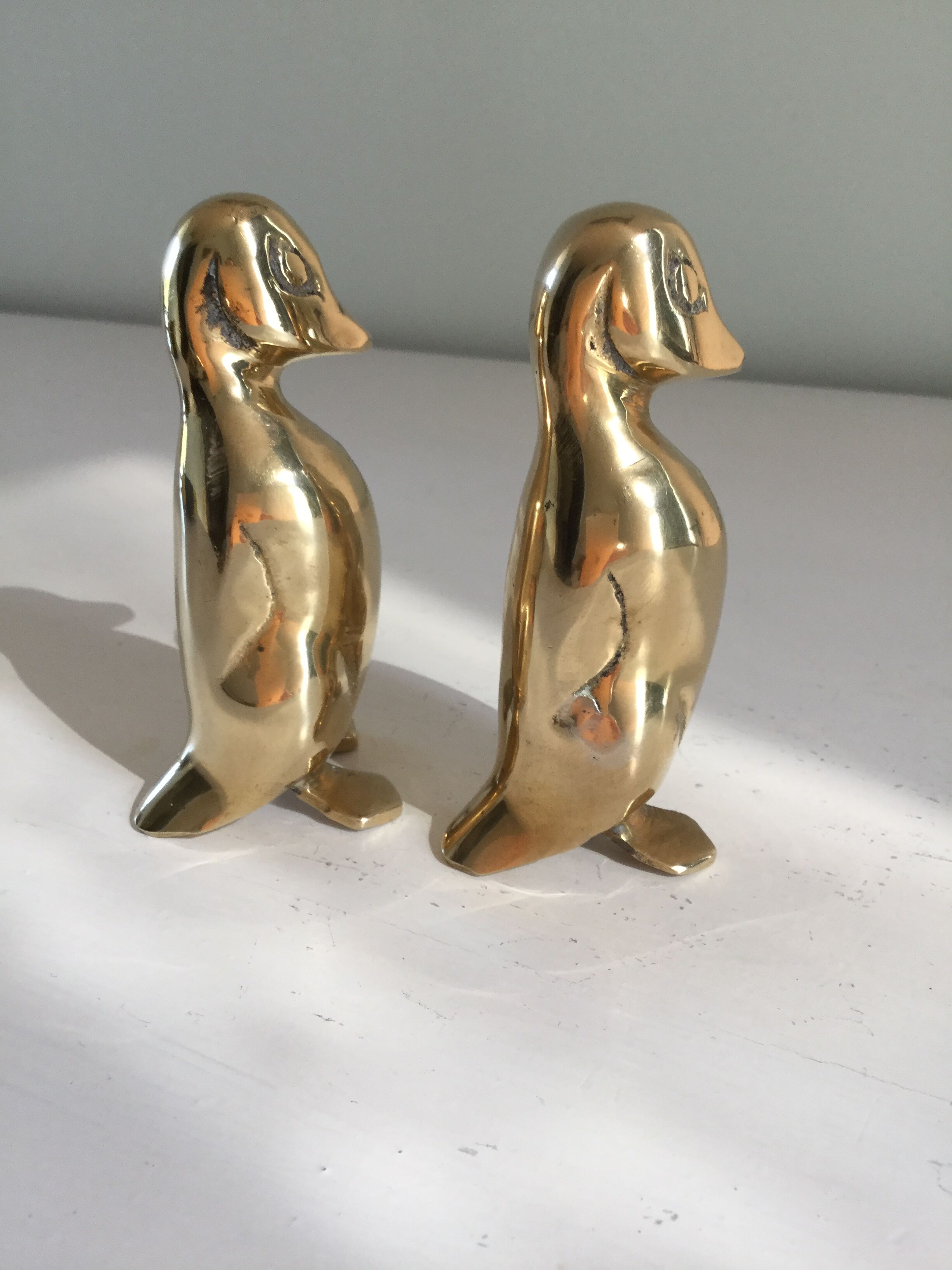 Golden brass penguins
