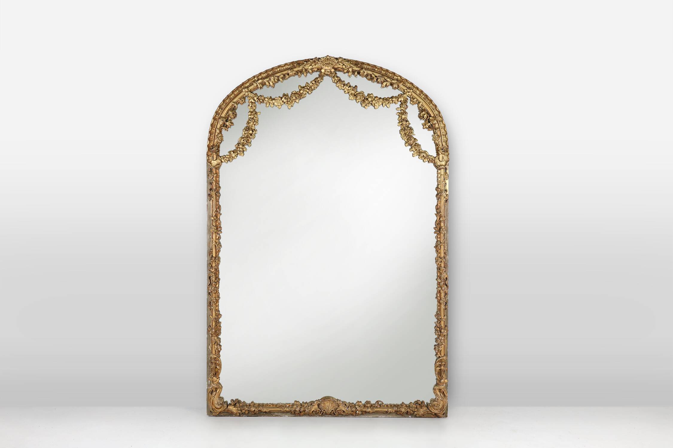 Large baroque decorated chimney mirror in gilted wood, France ca. 1800