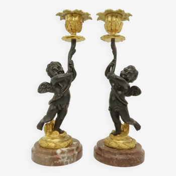 Paire de bougeoirs aux putti style Louis XVI du XIXe - bronze