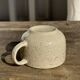 Set of 4 vintage speckled beige stoneware coffee cups.