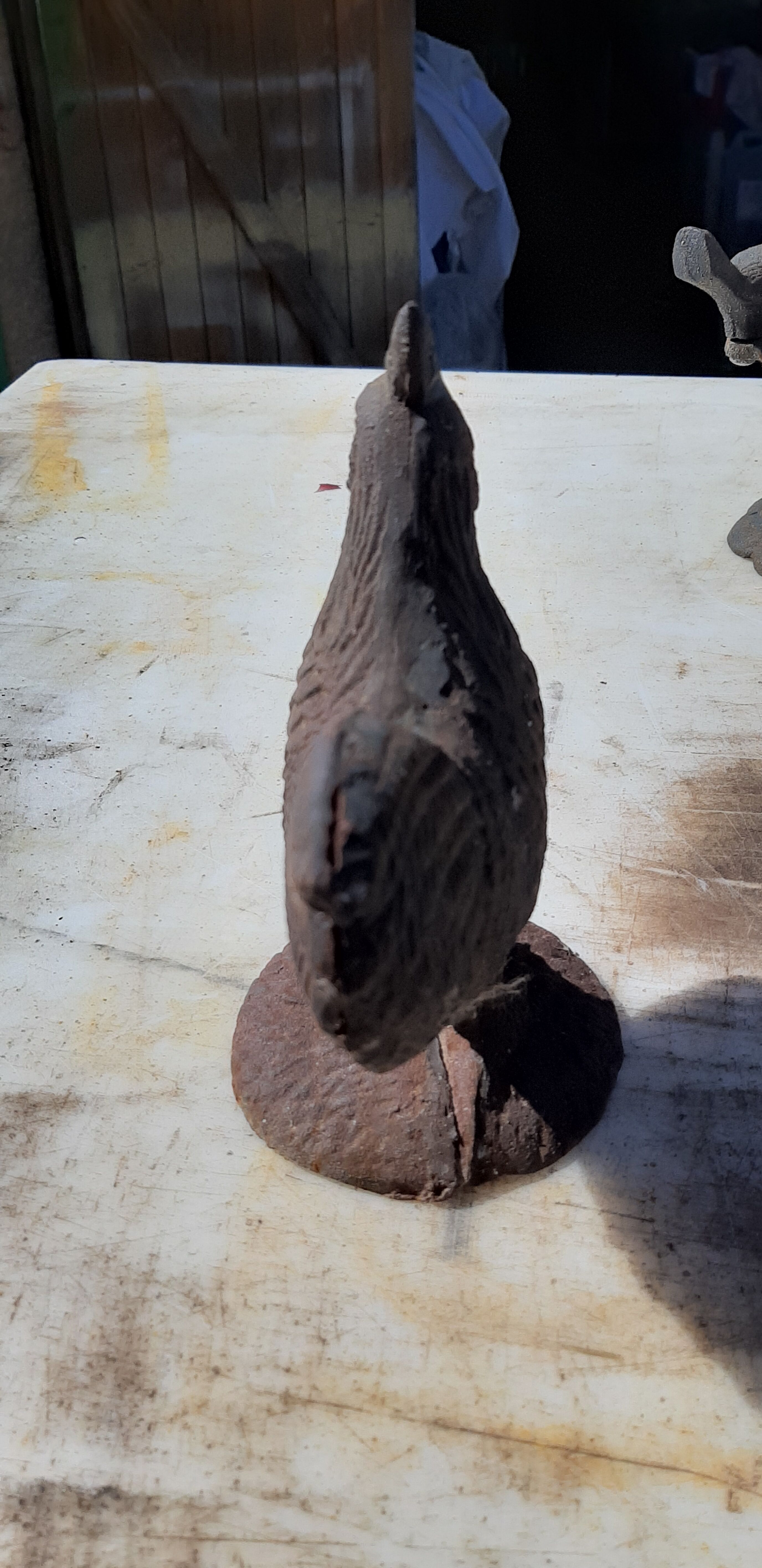 2 roosters and 2 cast iron birds